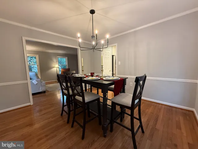 a view of a livingroom with furniture and hardwood floor