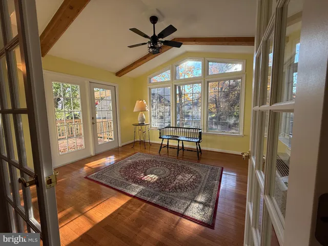 a bathroom with a bathtub sink and mirror