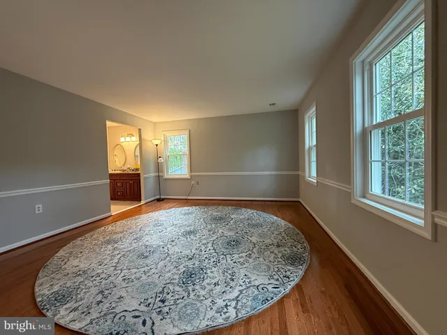 a bathroom with a toilet a sink and a window