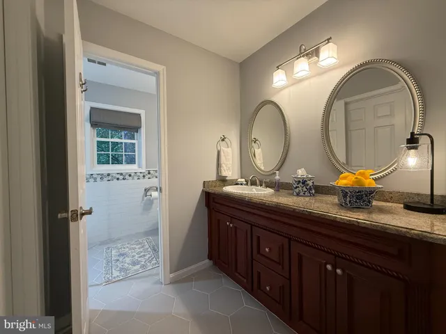 a utility room with washing machine and a view of washer