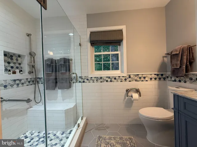 a view of a room with window and wooden floor