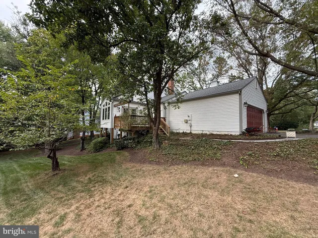 a view of deck with wooden floor and fence with a large garden