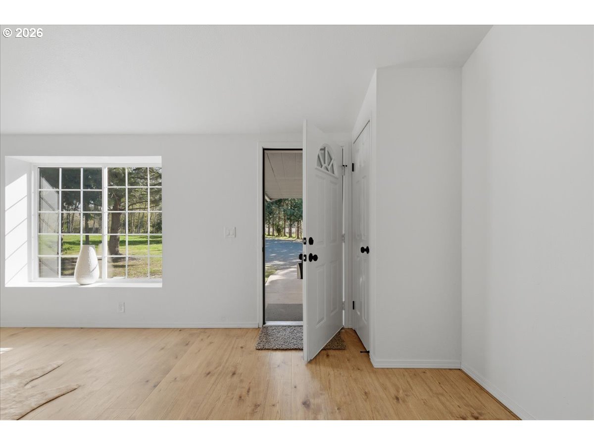 176 Tara Lane Vader, WA 98593 - Photo 3 of 36 a view of an empty room with a window
