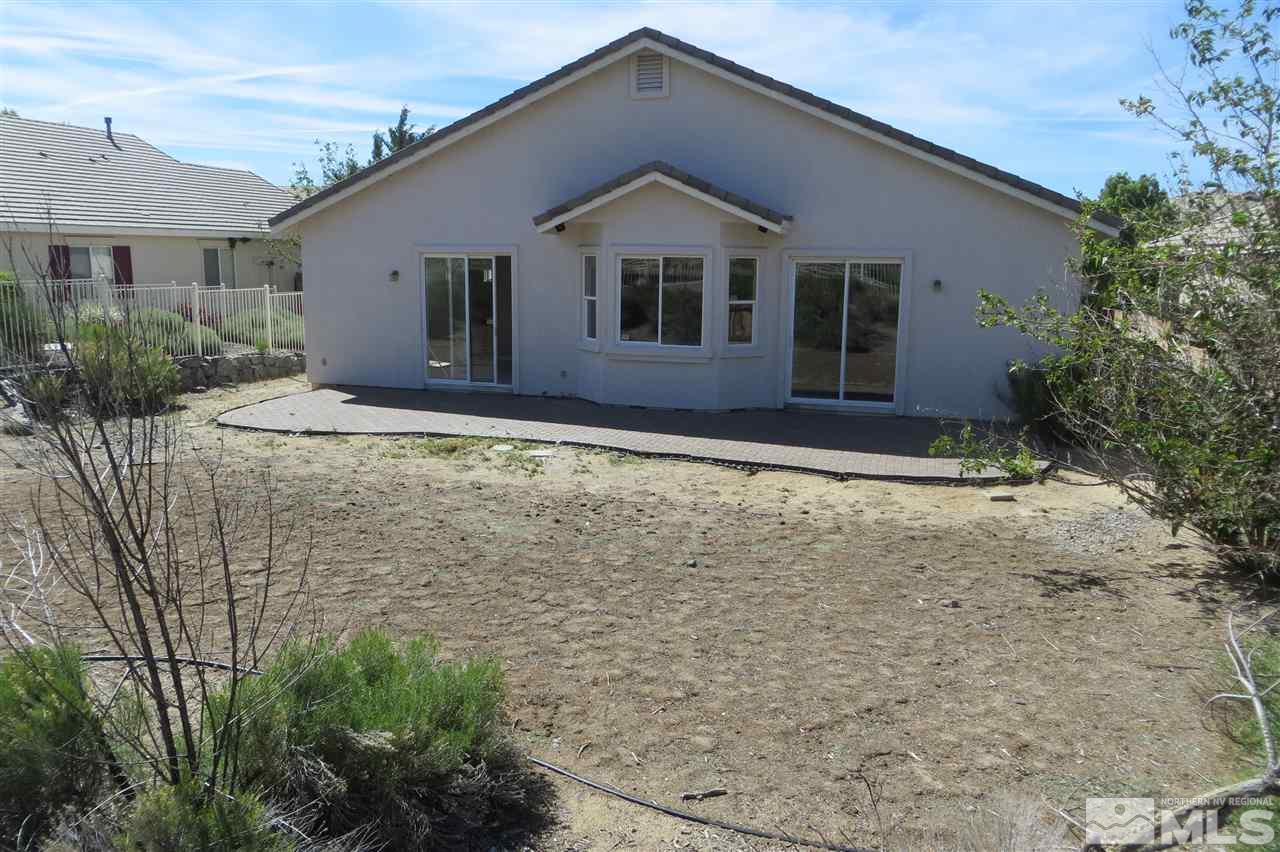 10092 Cascade Falls Drive Reno, NV 89521 - Photo 16 of 22 a house with trees in the background