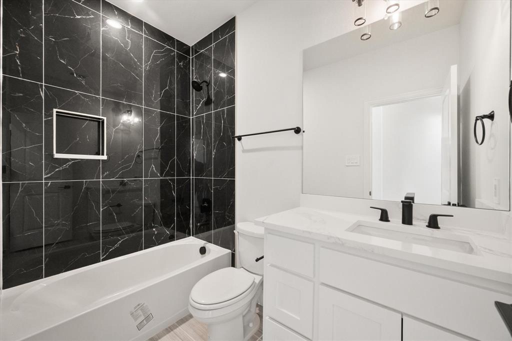 3400 Dobbins Road Corsicana, TX 75110 - Photo 24 of 40 a bathroom with a sink toilet vanity and shower