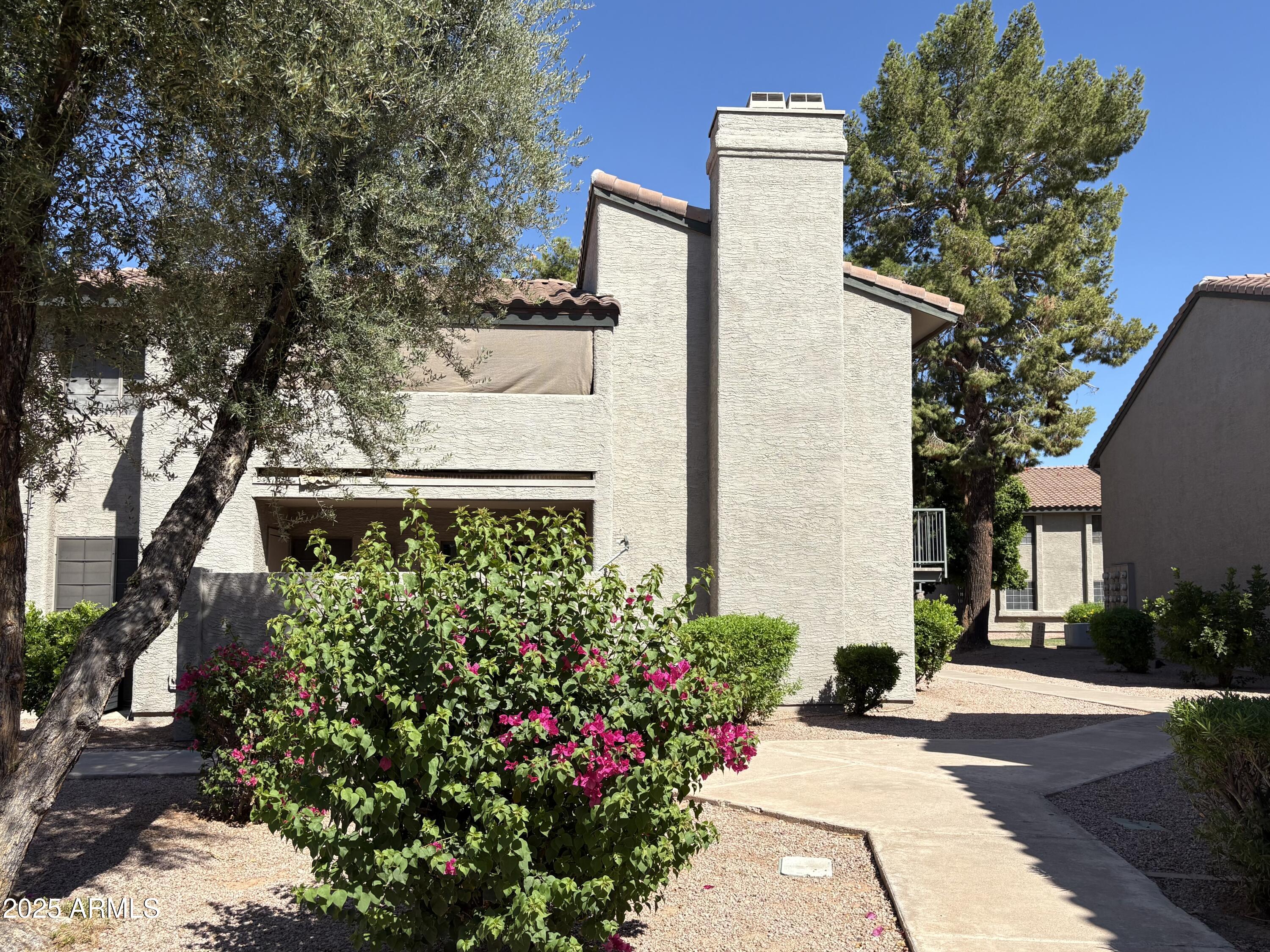 front view of a house with a small yard