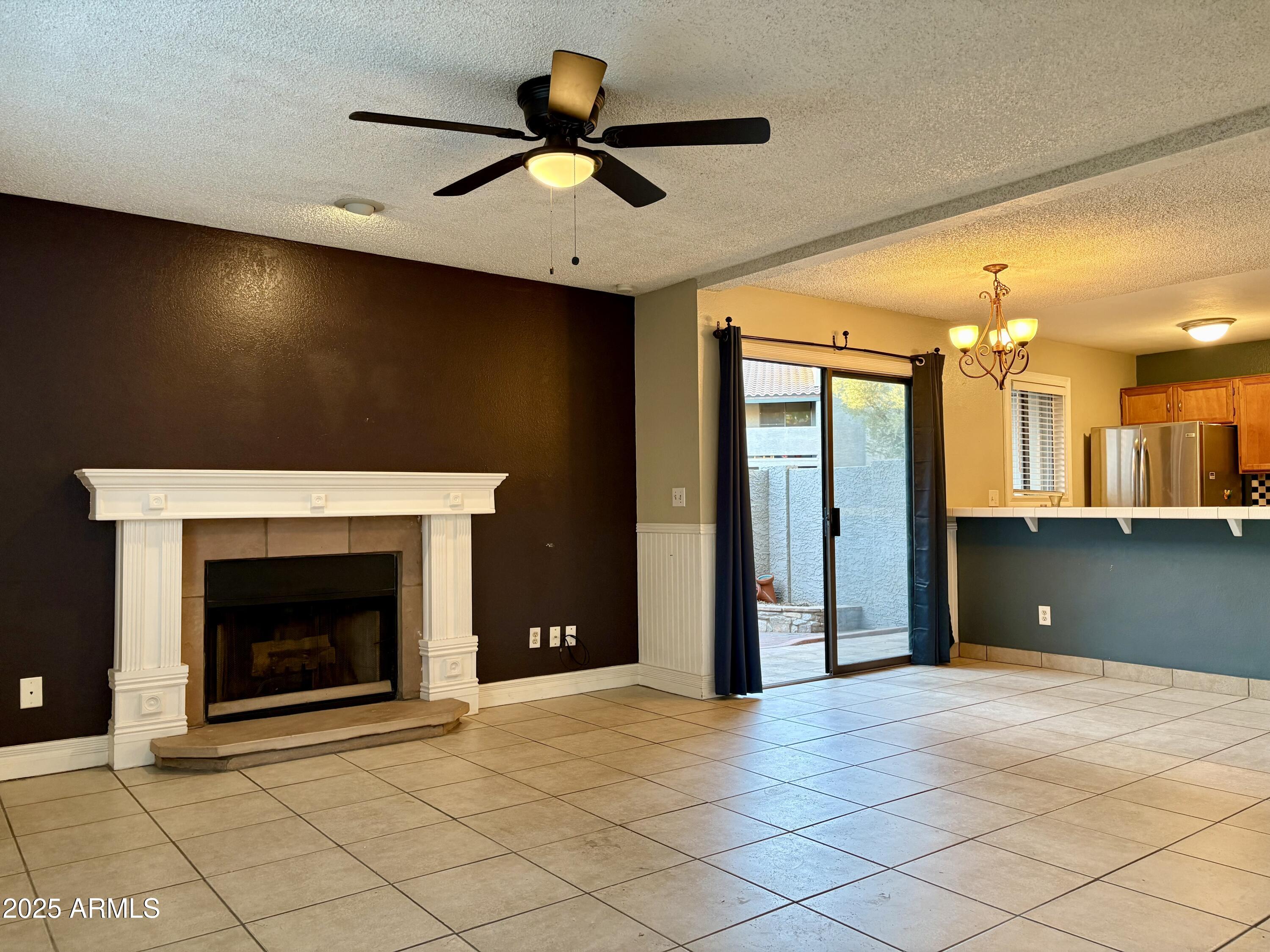 533 West Guadalupe Road, Unit 1122 Mesa, AZ 85210 - Photo 2 of 24 a view of an empty room with a fireplace