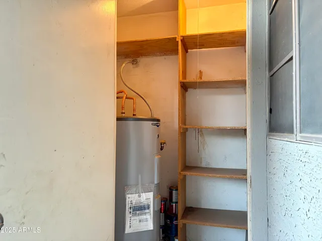 a bathroom with a glass door shower and a sink