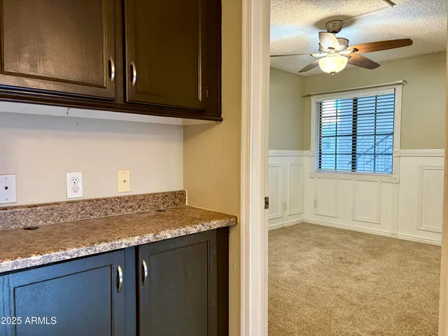 a view of a kitchen with marble kitchen and cabinet