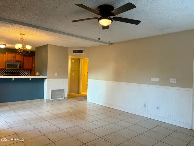 a view of a kitchen with a sink and cabinets