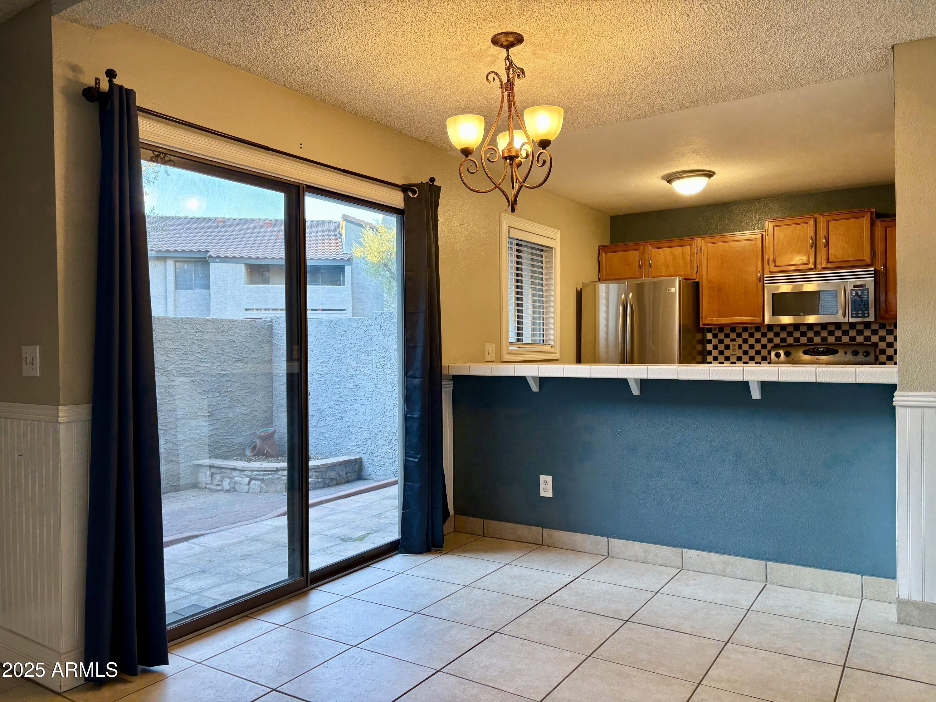 533 West Guadalupe Road, Unit 1122 Mesa, AZ 85210 - Photo 8 of 24 a view of a room with a large window