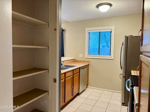 a view of walk in closet with window