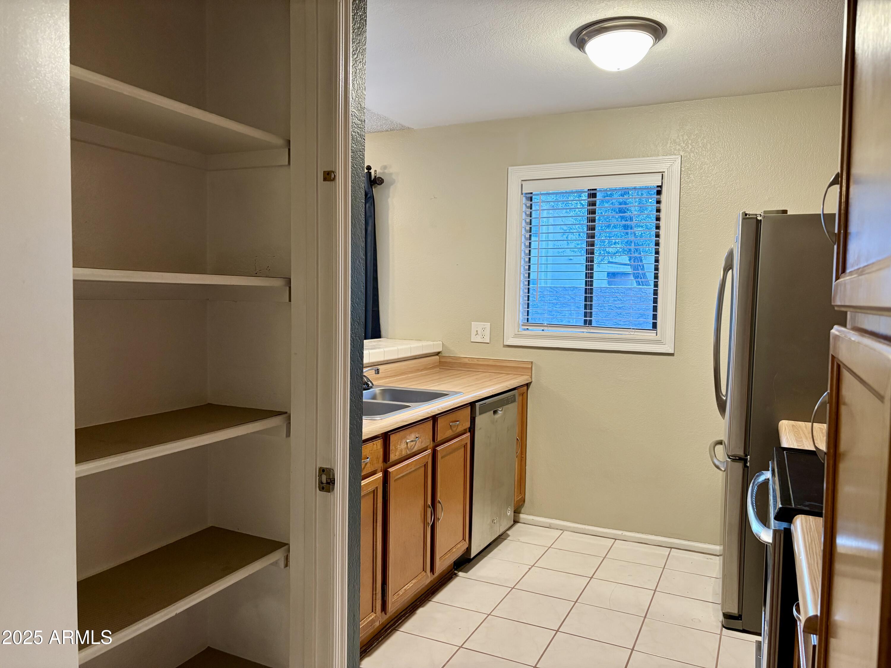 533 West Guadalupe Road, Unit 1122 Mesa, AZ 85210 - Photo 10 of 24 a view of walk in closet with window