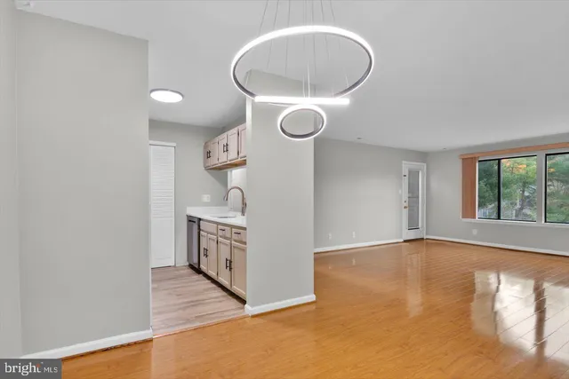 a kitchen with a sink cabinets and window