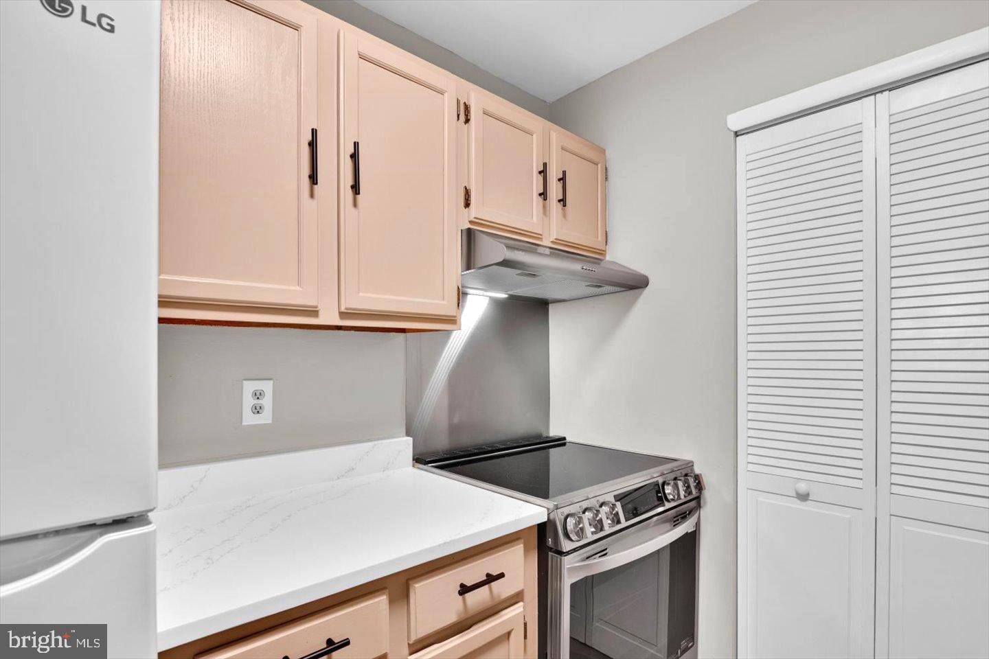1966 The Woods II Cherry Hill, NJ 08003 - Photo 17 of 33 a kitchen with a stove and cabinets