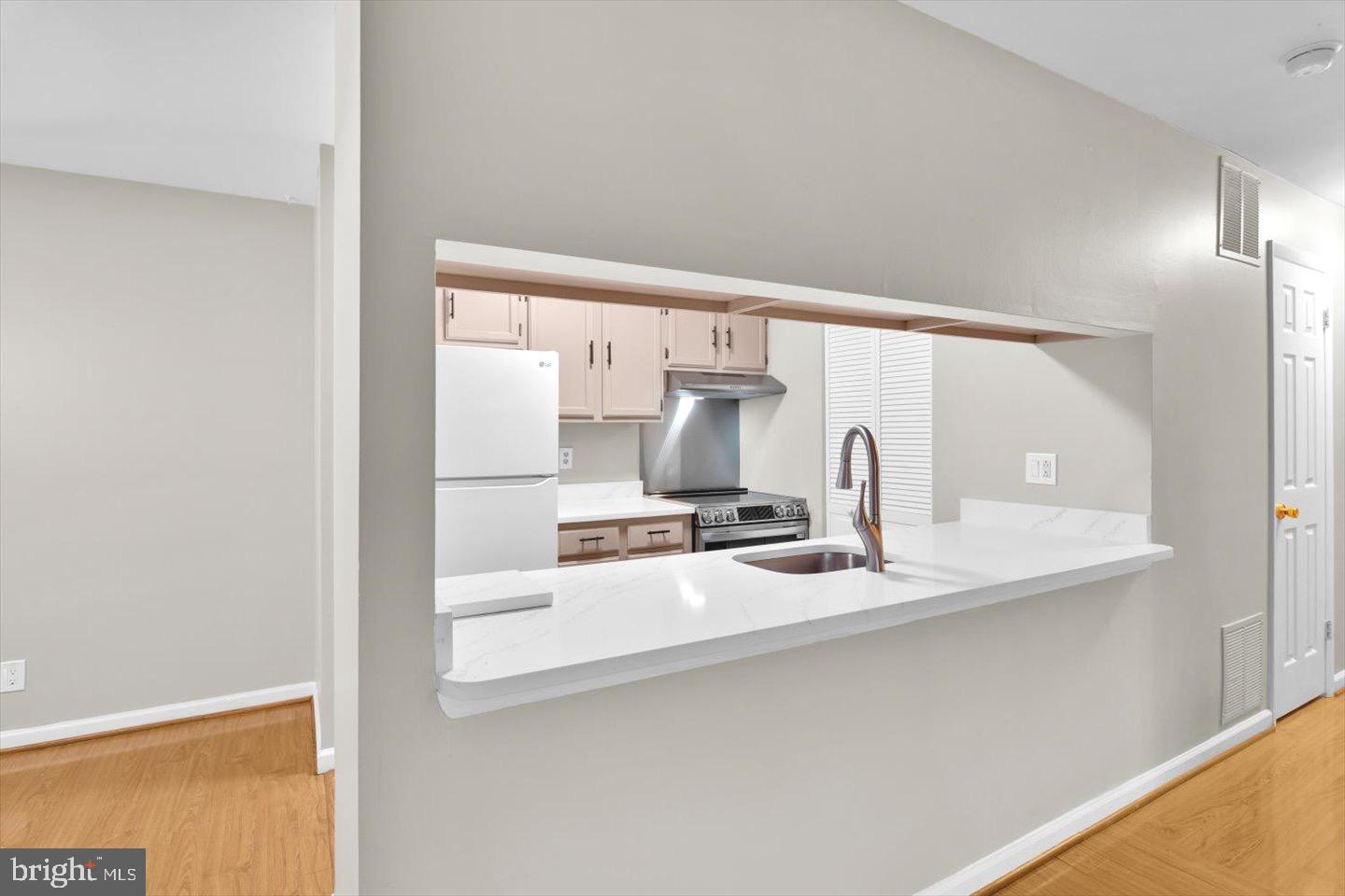 1966 The Woods II Cherry Hill, NJ 08003 - Photo 20 of 33 a kitchen with a sink and a stove top oven