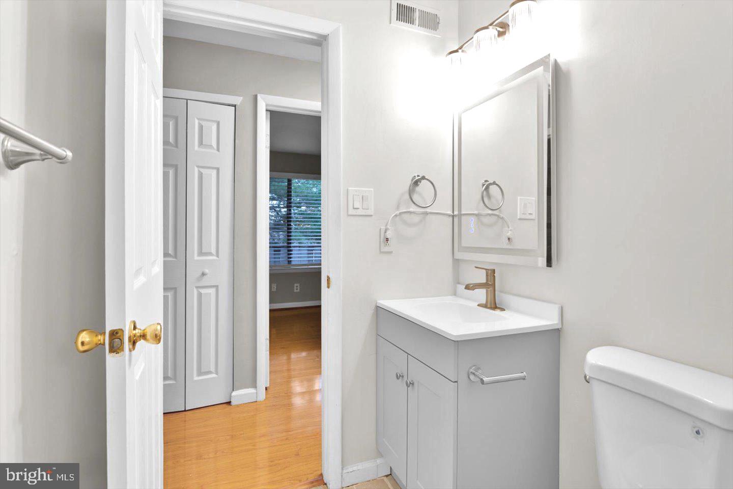 1966 The Woods II Cherry Hill, NJ 08003 - Photo 31 of 33 a bathroom with a sink and a mirror
