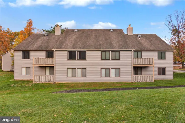 a view of a building with a yard
