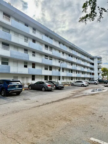 a view of street with parked cars