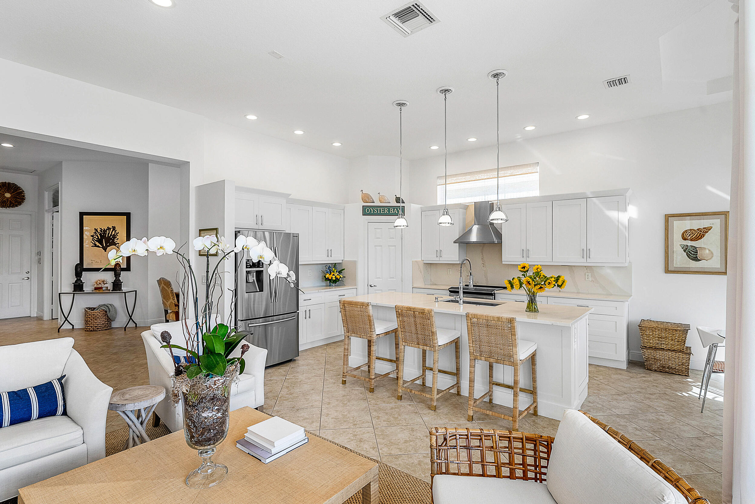 9666 Via Elegante Wellington, FL 33411 - Photo 11 of 37 a living room with lots of furniture and kitchen view