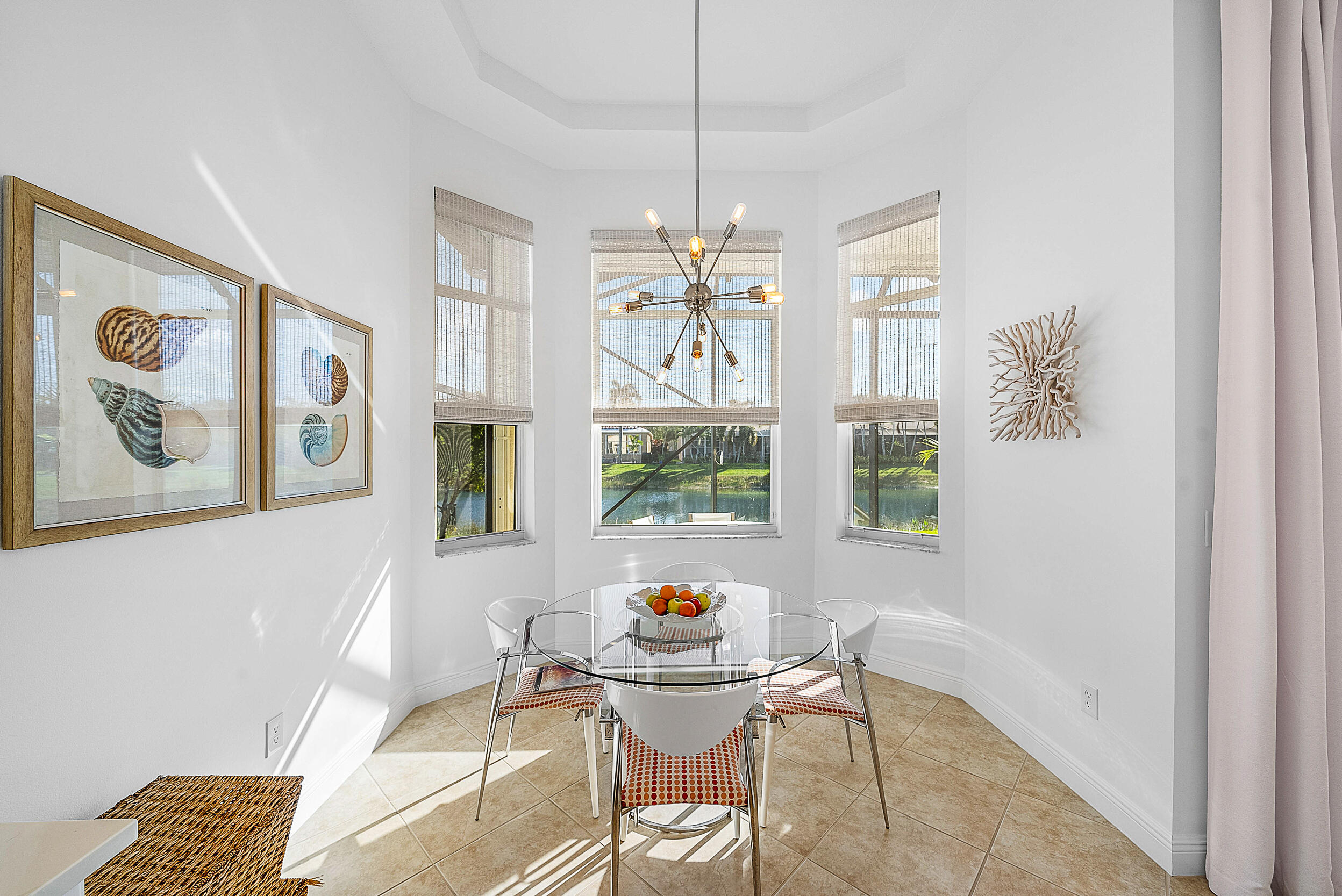 9666 Via Elegante Wellington, FL 33411 - Photo 14 of 37 a living room with furniture and a chandelier