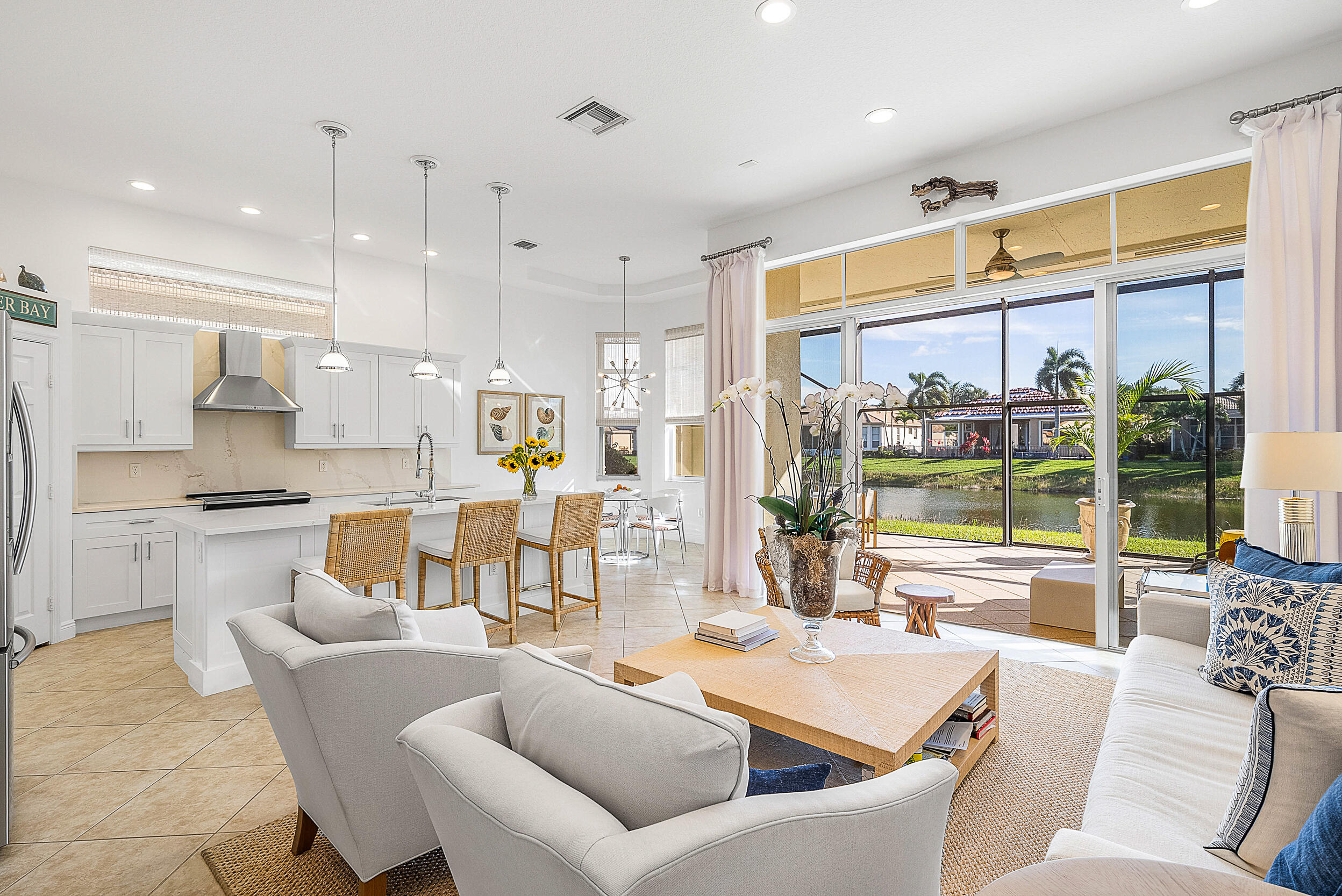 9666 Via Elegante Wellington, FL 33411 - Photo 2 of 37 a living room with furniture and a large window