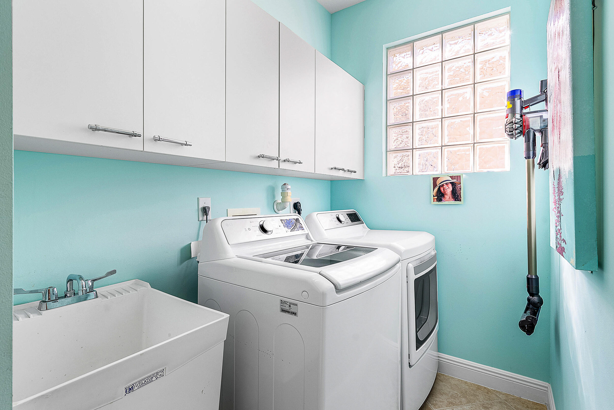 9666 Via Elegante Wellington, FL 33411 - Photo 23 of 37 a utility room with dryer and washer