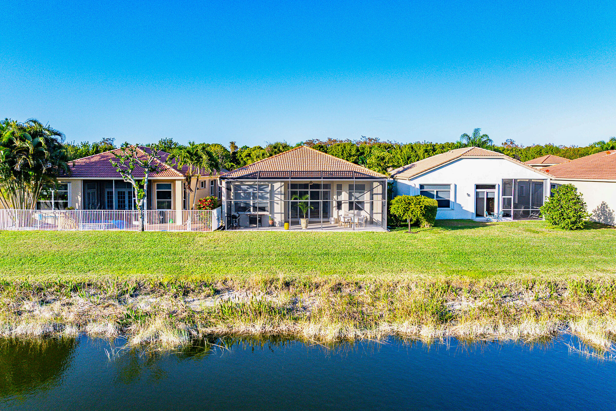 9666 Via Elegante Wellington, FL 33411 - Photo 27 of 37 a front view of house with yard and green space