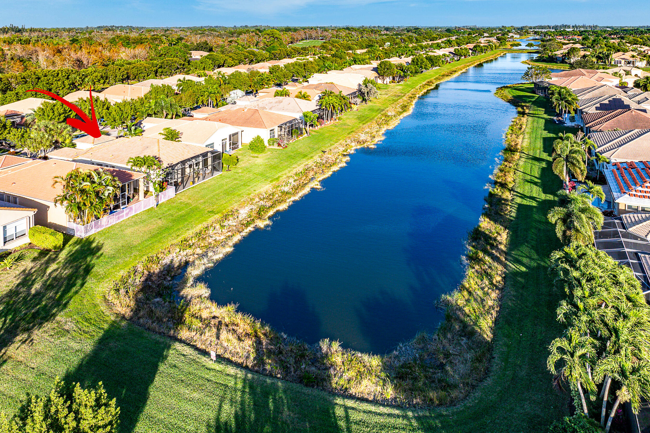 9666 Via Elegante Wellington, FL 33411 - Photo 28 of 37 a view of a swimming pool with an outdoor space and seating area