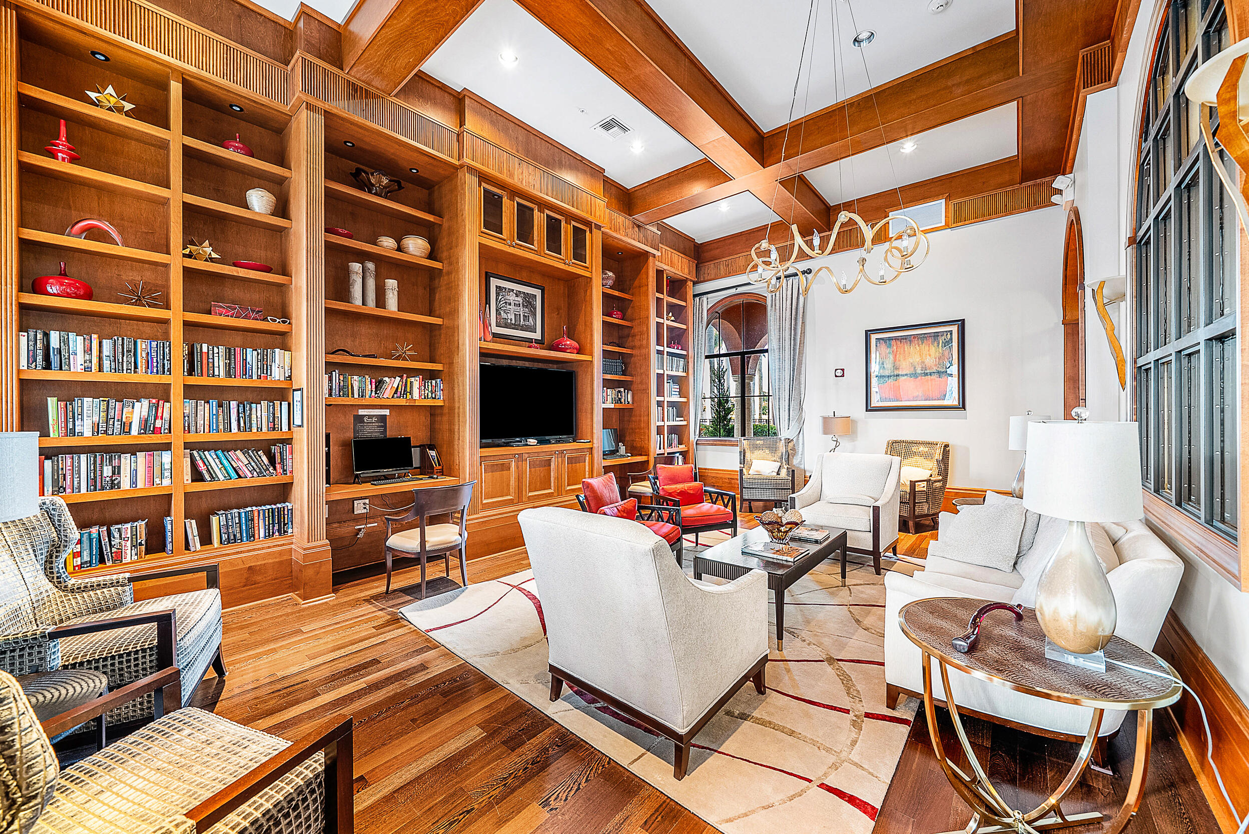 9666 Via Elegante Wellington, FL 33411 - Photo 34 of 37 a living room with fireplace furniture and a book shelf