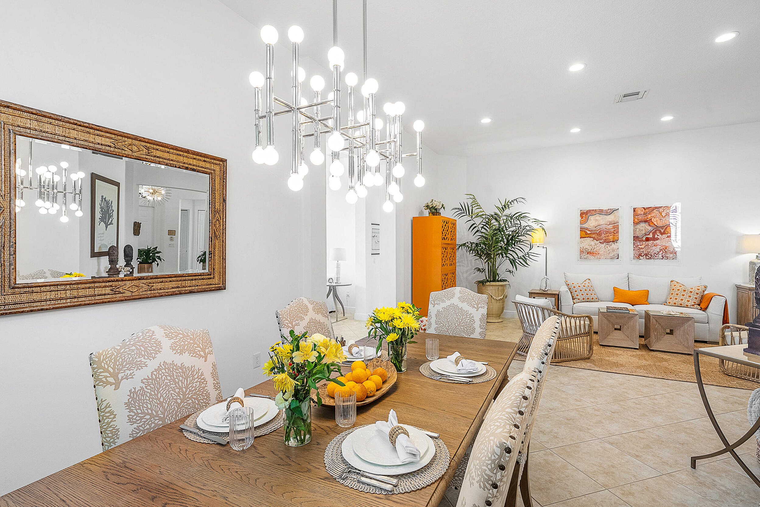9666 Via Elegante Wellington, FL 33411 - Photo 4 of 37 a living room with furniture and a chandelier