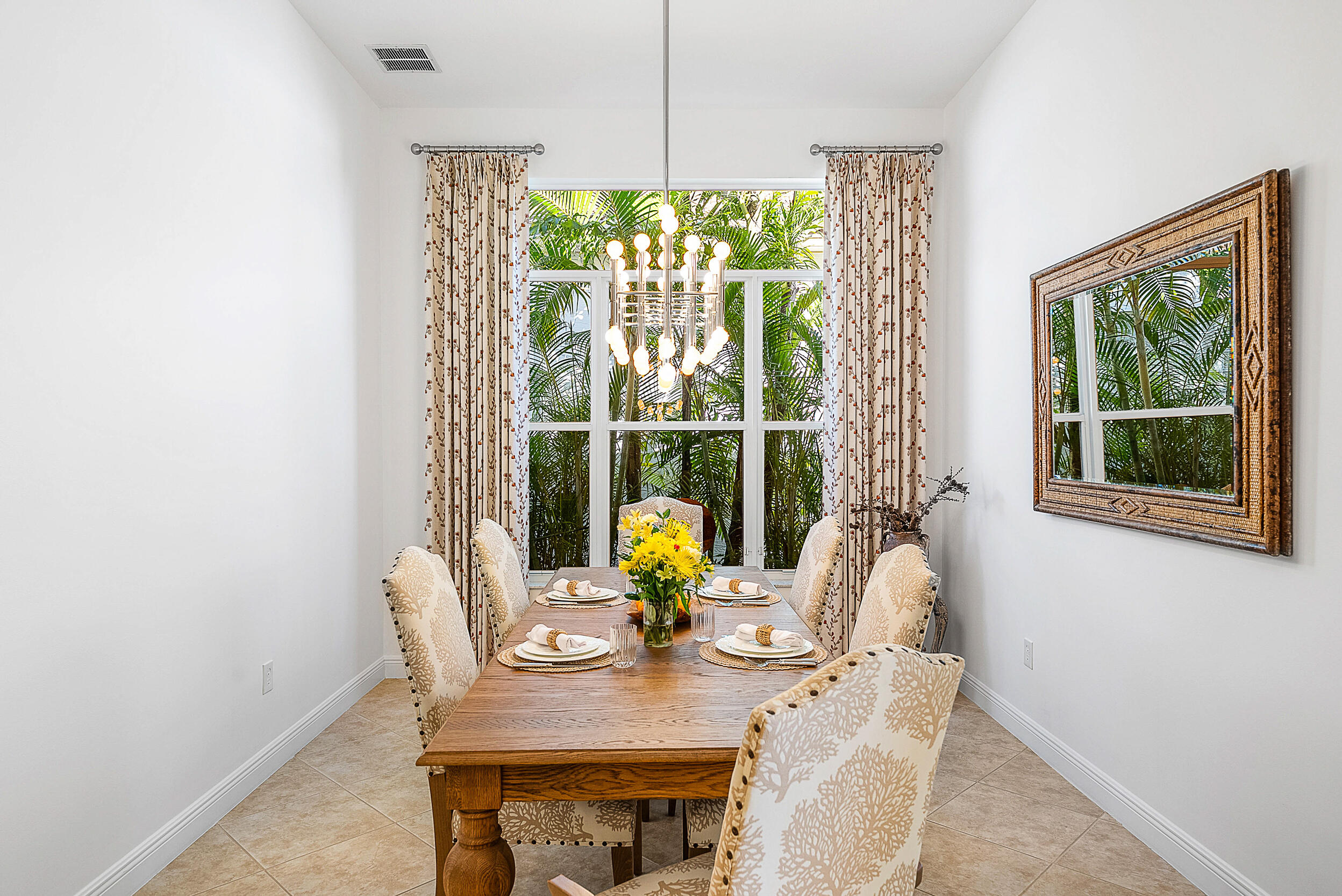 9666 Via Elegante Wellington, FL 33411 - Photo 6 of 37 a view of a dining room with furniture window and outside view