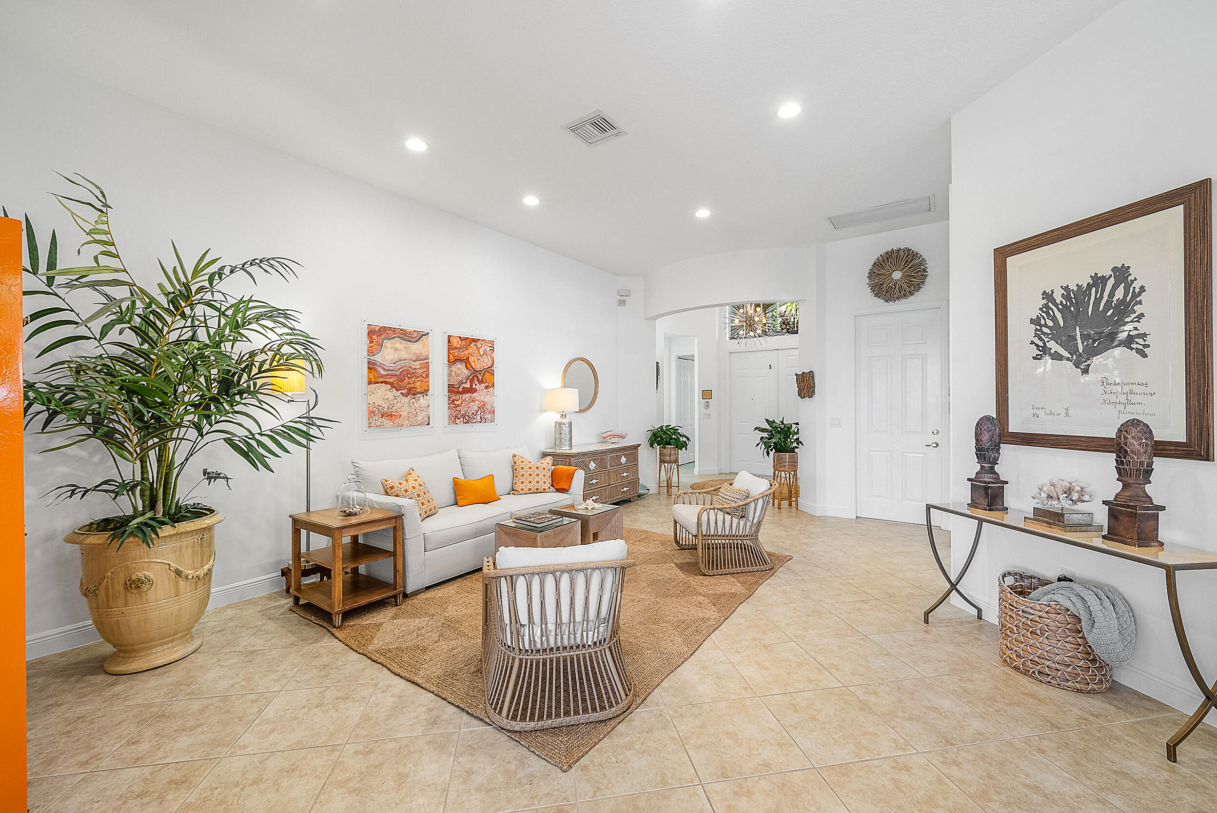 9666 Via Elegante Wellington, FL 33411 - Photo 7 of 37 a living room with furniture and potted plant