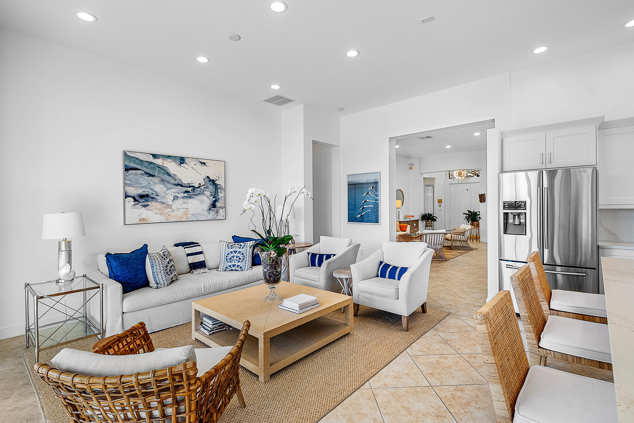 9666 Via Elegante Wellington, FL 33411 - Photo 8 of 37 a living room with furniture and a chandelier