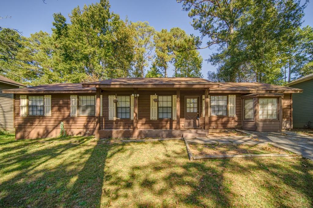 549 Raintree Drive Jonesboro, GA 30238 - Photo 1 of 1 a front view of a house with a garden