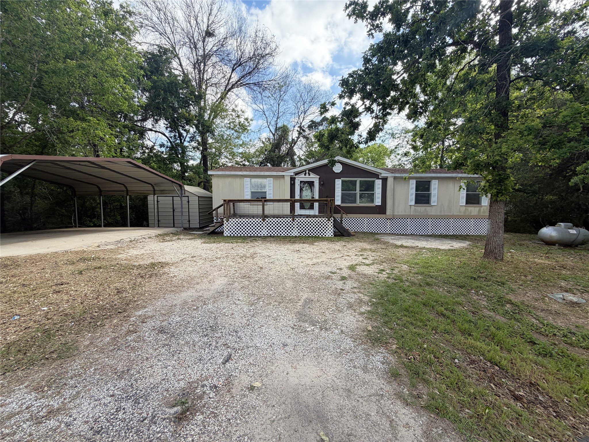 161 Farm To Market 1617 Trinity, TX 75862 - Photo 2 of 15 a view of a house with a yard and large trees