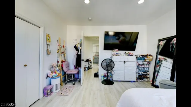 a bathroom with a sink mirror and shower