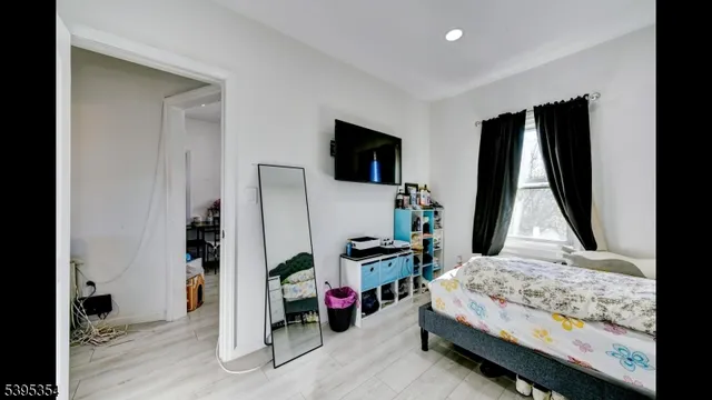a view of a hallway with dining area and chandelier