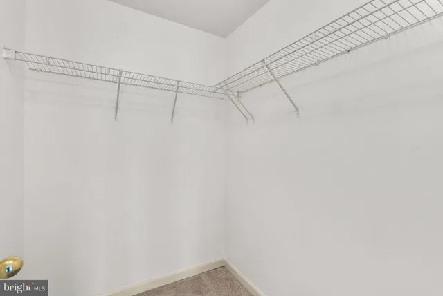 a bedroom with a bed and cabinets