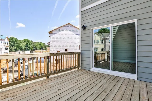 a view of a balcony with wooden floor