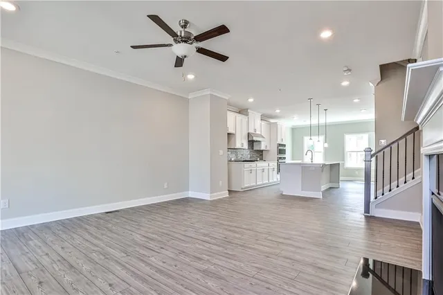 a view of kitchen with wooden floor and window