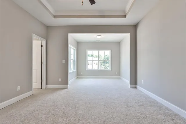 an empty room that has a window in it