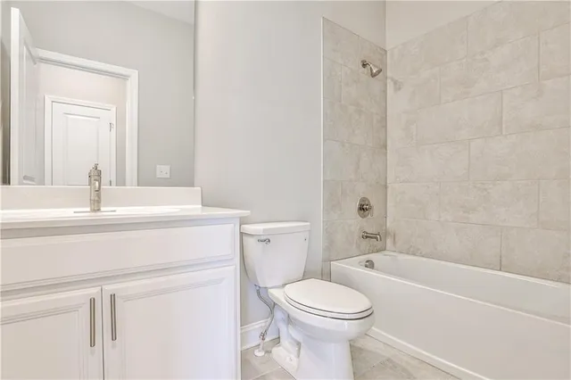 a bathroom with a sink a toilet and a bathtub