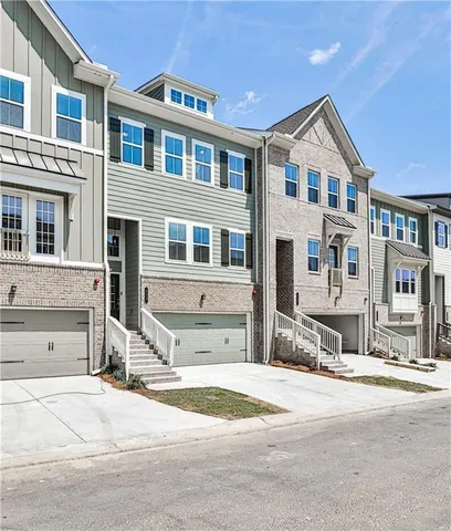 a front view of a building with a street