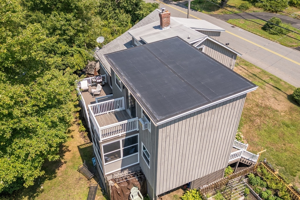 63 River Street Andover, MA 01810 - Photo 12 of 40 a front view of a house with a yard