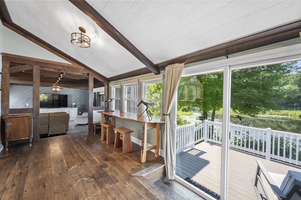 63 River Street Andover, MA 01810 - Photo 17 of 40 a view of a dining room with furniture window and wooden floor