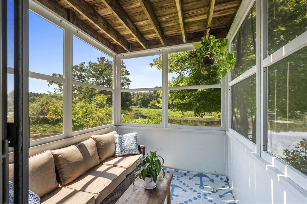 63 River Street Andover, MA 01810 - Photo 19 of 40 a living room with furniture and a potted plant