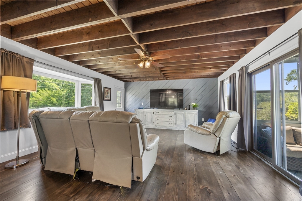 63 River Street Andover, MA 01810 - Photo 20 of 40 a living room with furniture and a large window