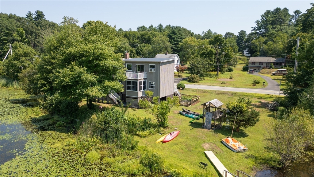 63 River Street Andover, MA 01810 - Photo 2 of 40 a view of a swimming pool with a patio