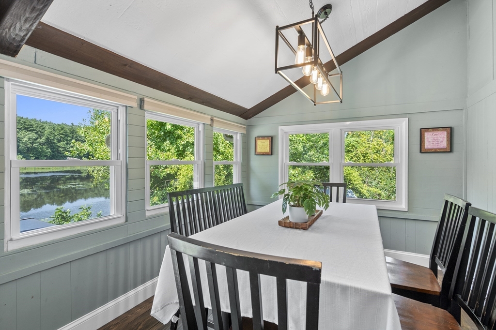 63 River Street Andover, MA 01810 - Photo 23 of 40 a view of a dining room with furniture a chandelier and wooden floor